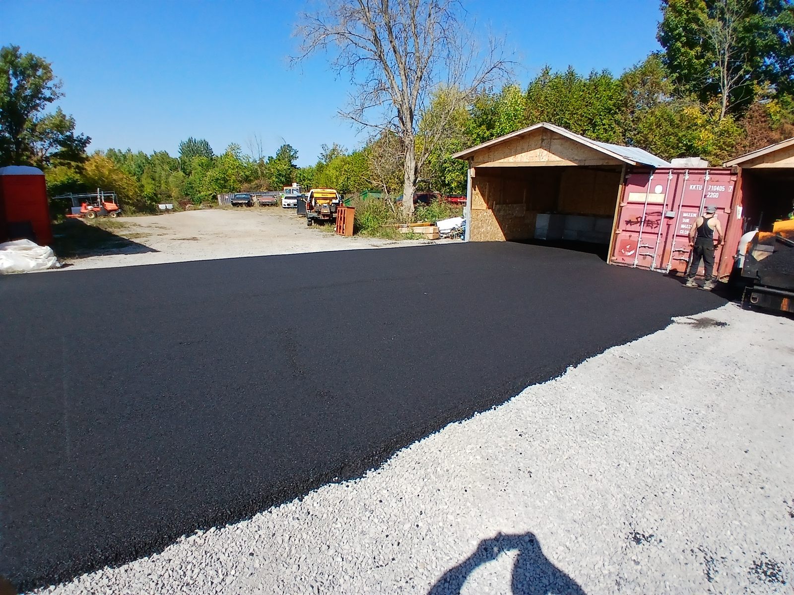 Freshly paved commercial asphalt pad at a yard in Ottawa