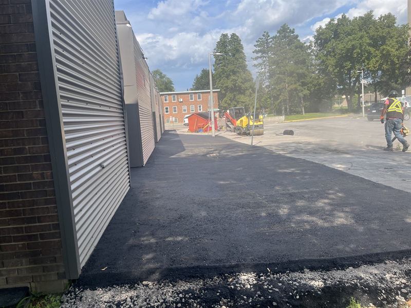 New asphalt surface laid alongside a commercial building in Ottawa