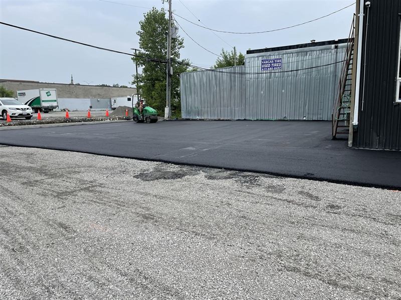 Freshly resurfaced commercial asphalt parking lot beside a building in Ottawa