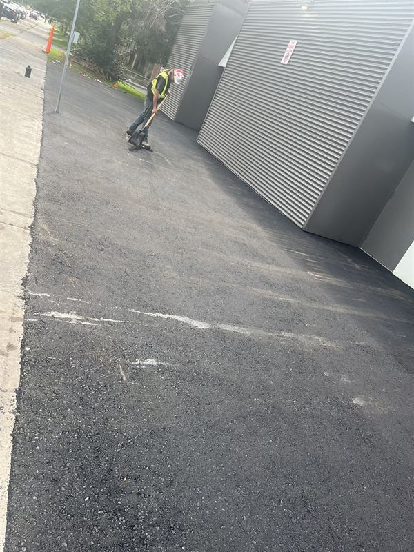 New asphalt walkway repair alongside a commercial building in Ottawa