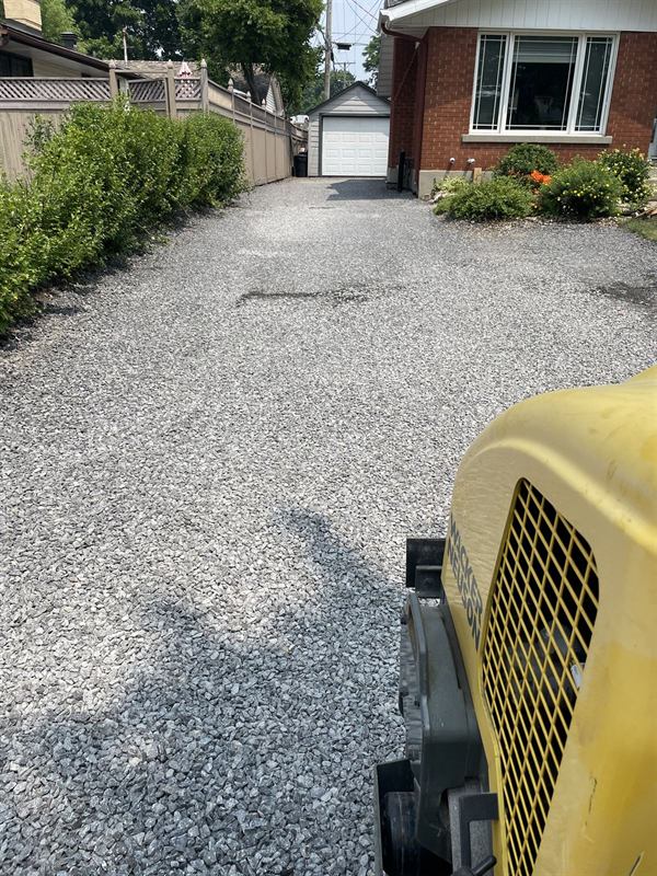 Freshly graded gravel driveway at an Ottawa property
