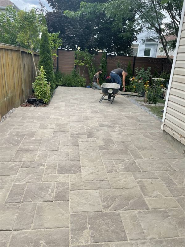 Finished interlocking paver patio in an Ottawa backyard