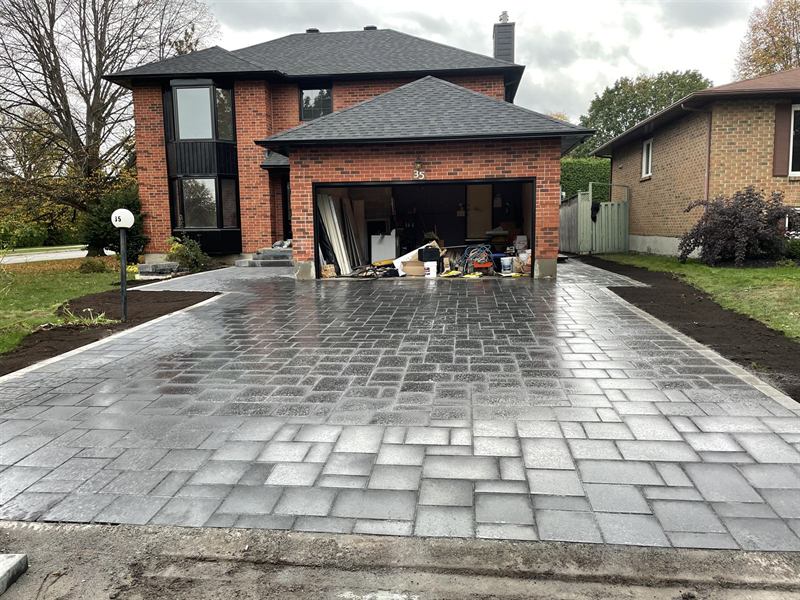 Interlocking paver driveway installed at a modern home in Ottawa