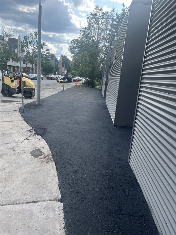Fresh asphalt strip paved along a commercial property in Ottawa